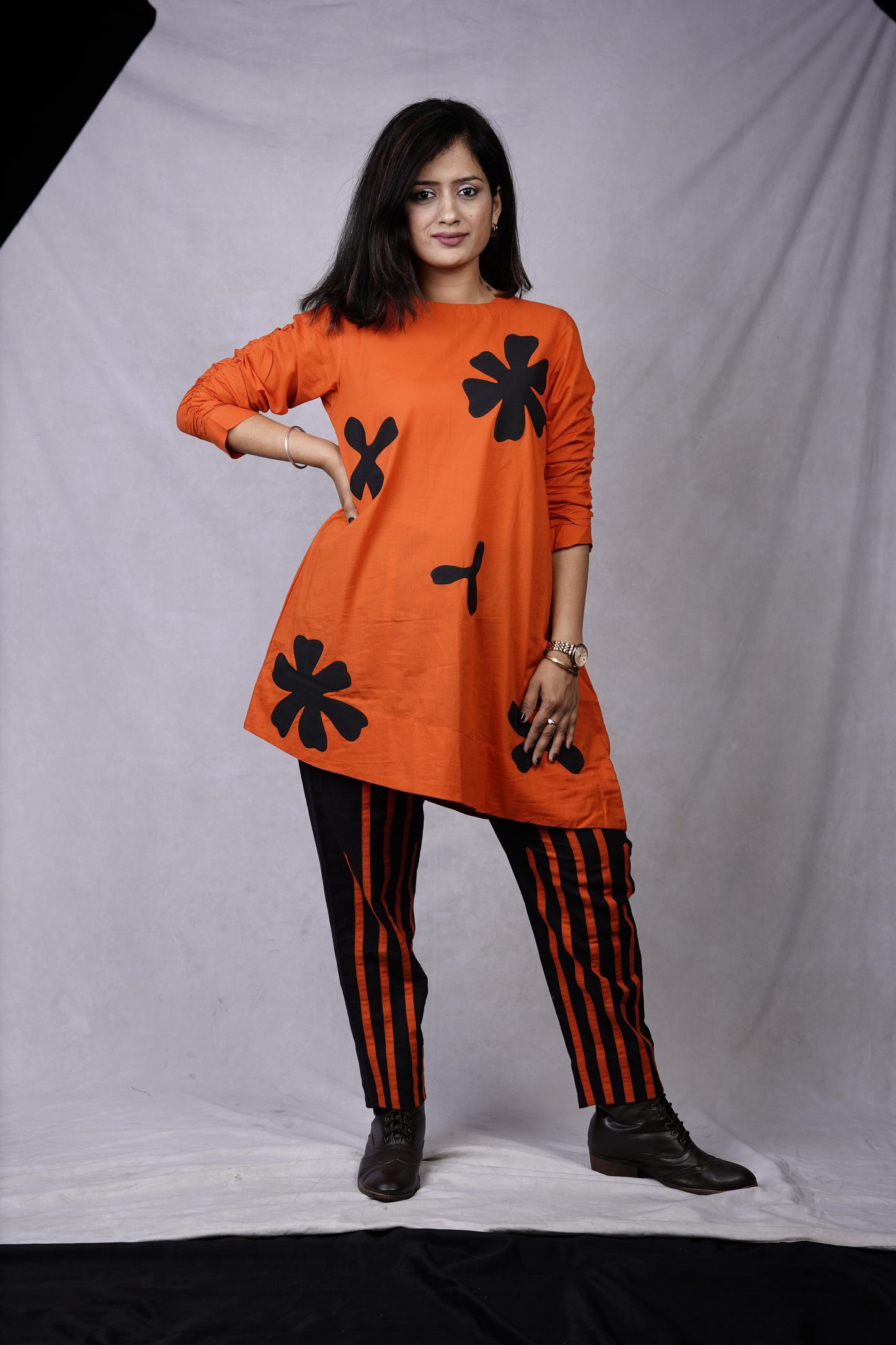 Orange coord with applique flower and stripes n pant