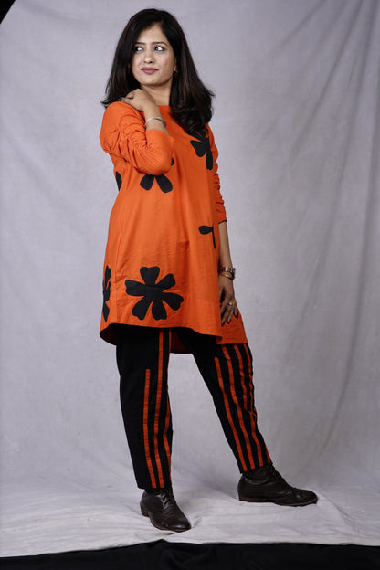 Orange coord with applique flower and stripes n pant